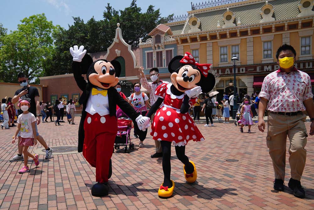 Hong Kong Disney opens as Covid eases; Shanghai deaths rise